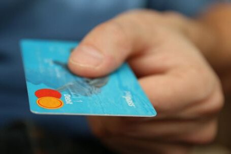 Customer Loyalty - Person Holding Debit Card