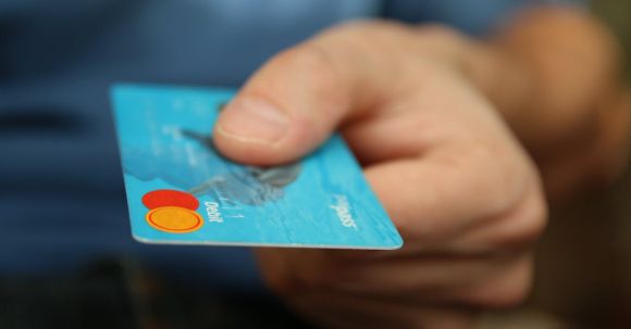 Customer Loyalty - Person Holding Debit Card