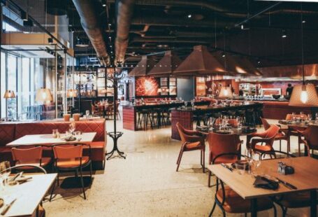 Restaurant - rectangular beige wooden tables and chair