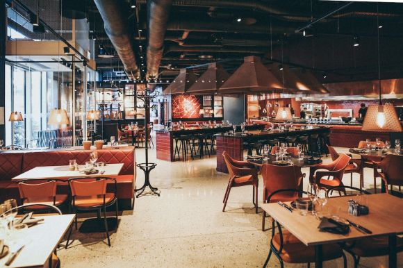 Restaurant - rectangular beige wooden tables and chair