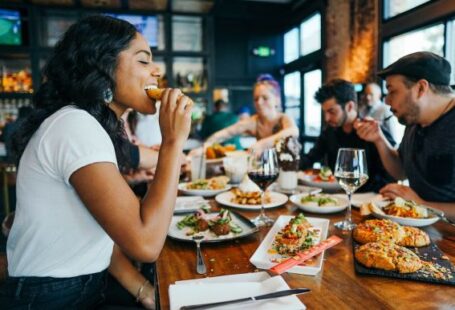 Restaurant - woman in white shirt eating